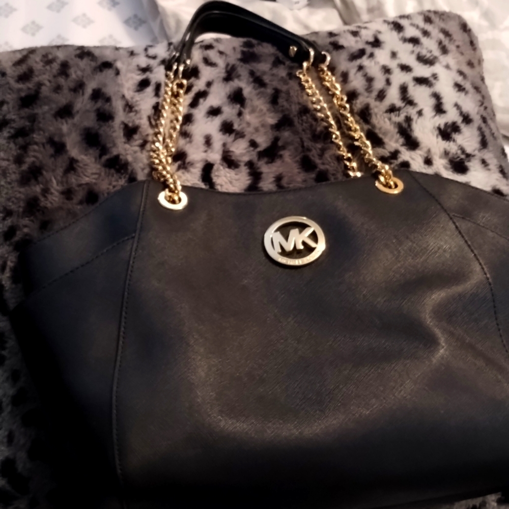 Black and gold chained Michael Kors large handbag. Used a few times.